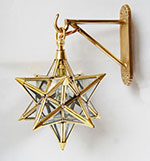 Wall triangular bracket with small Colonial lantern in polished brass